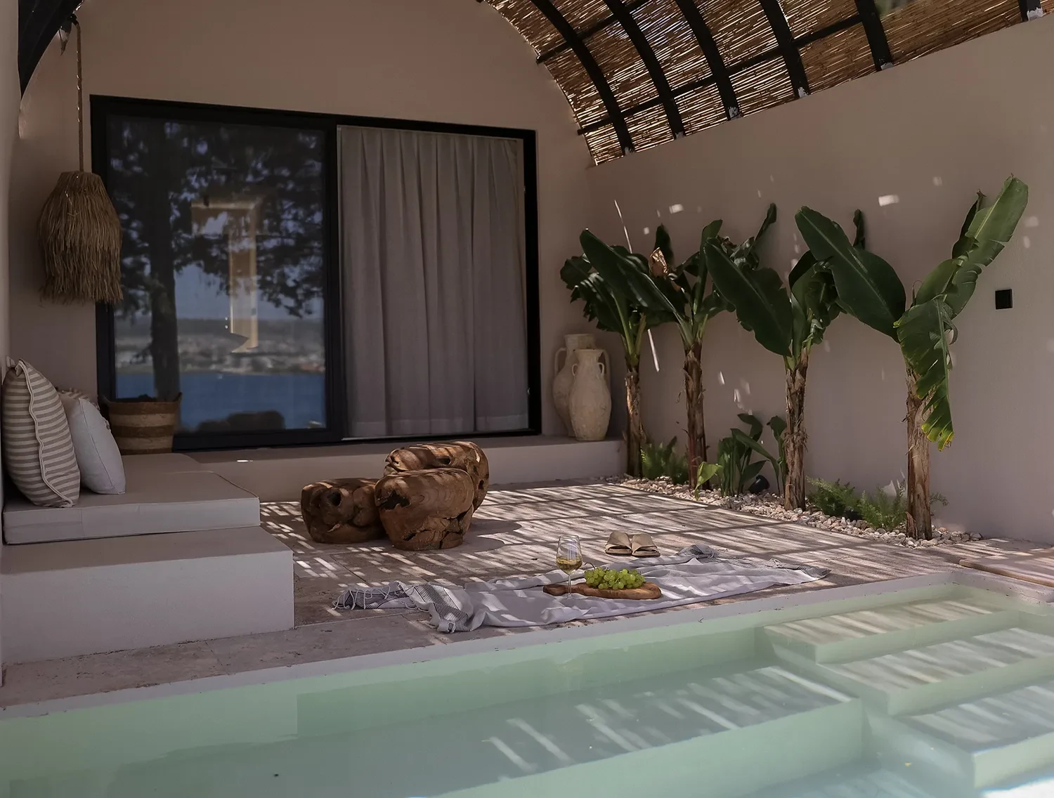 GAIA By The Sea — Pool and seating area in a room