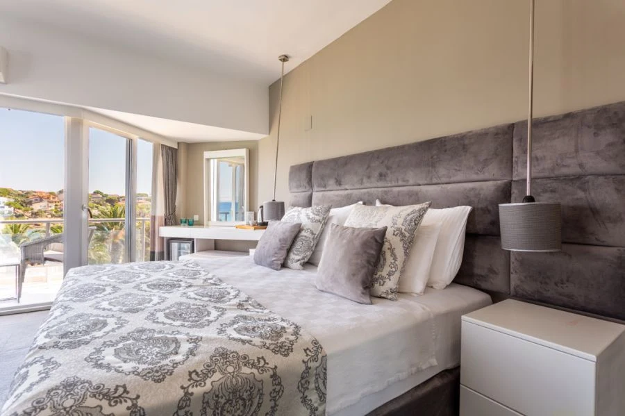 Bed and balcony in a hotel room