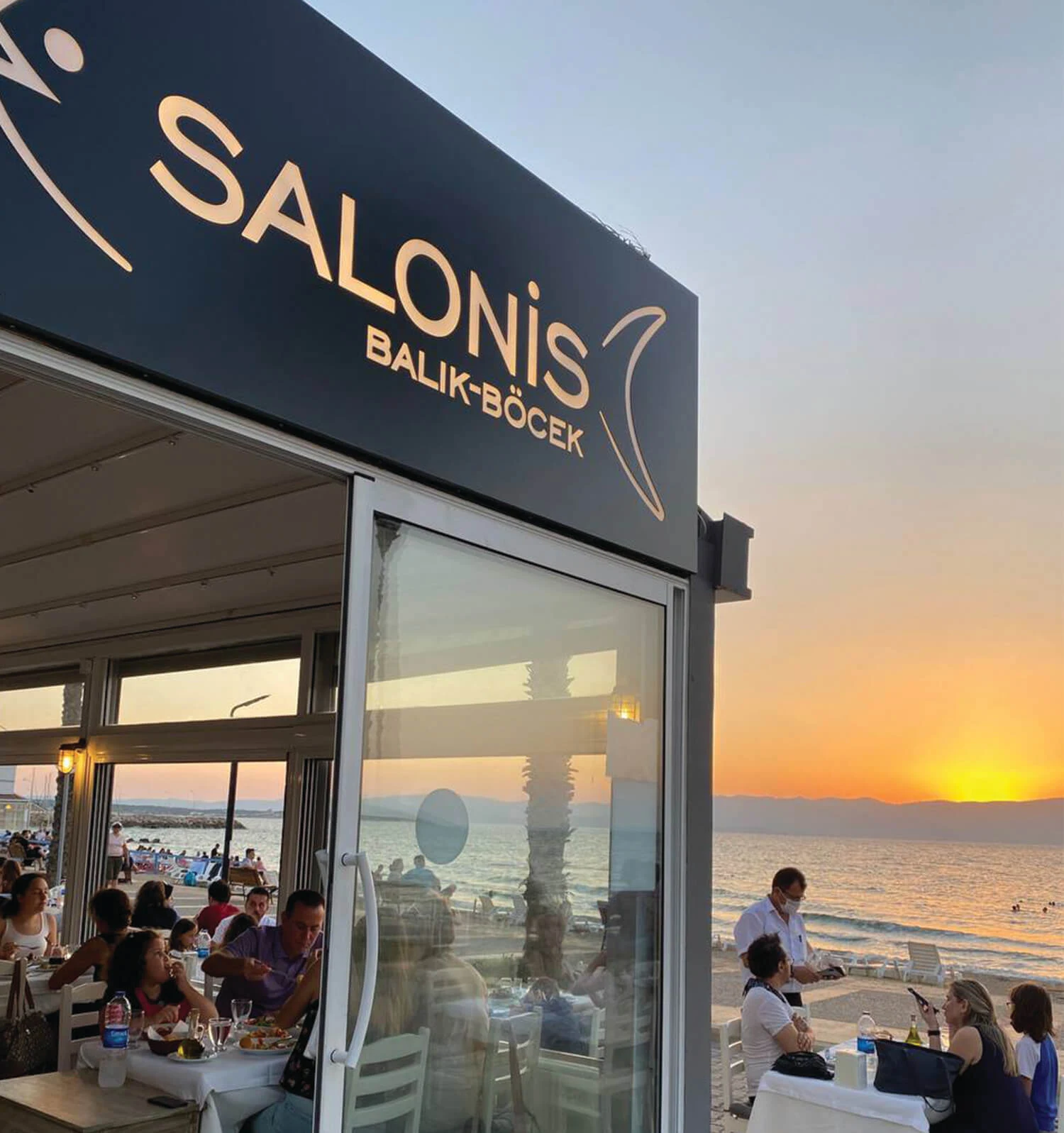 Salonis Restoran — Seafront exterior at sunset
