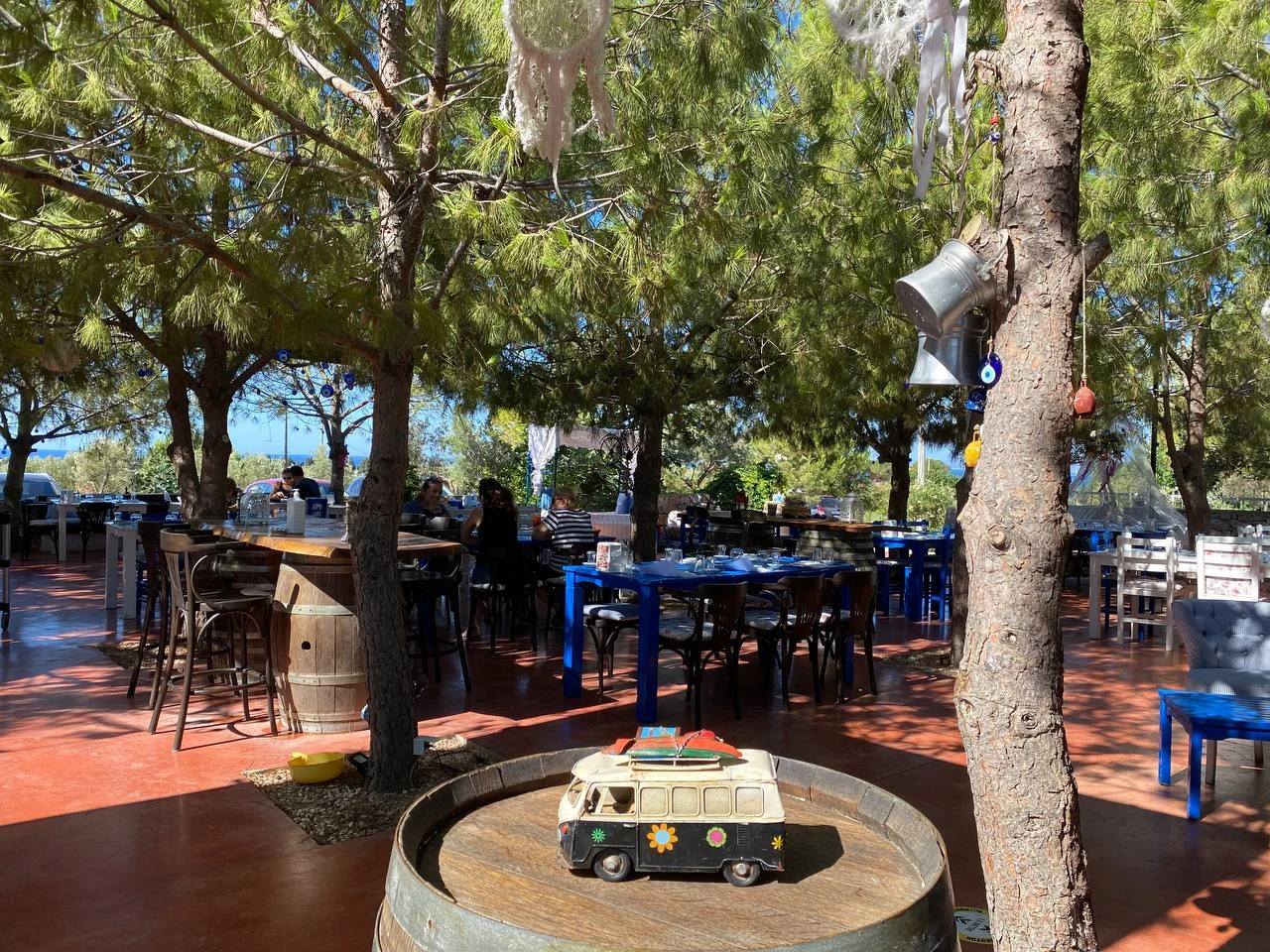 Noni’s House — Garden tables under trees