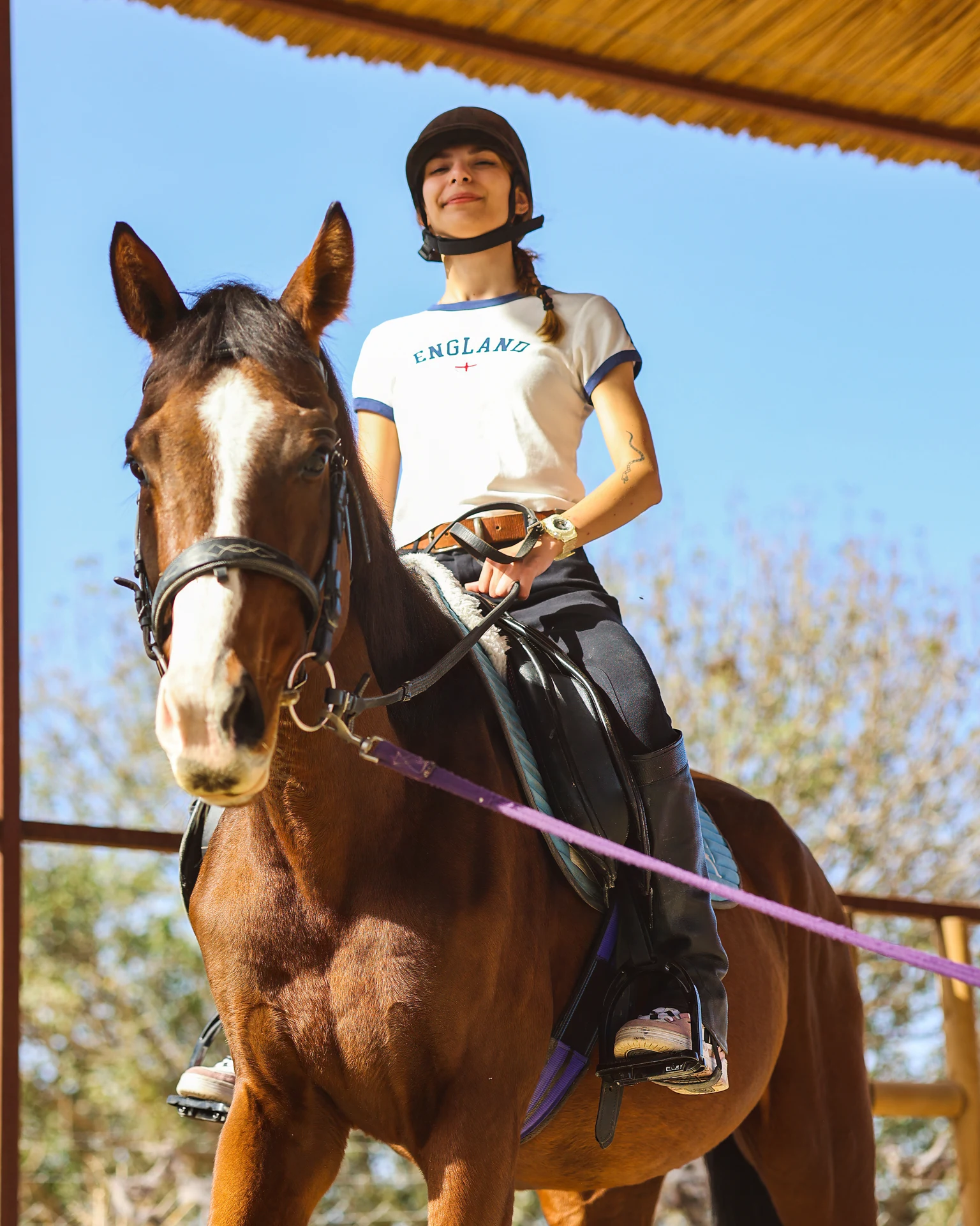 Çeşme Binicilik Kulübü — Rider and horse beside the arena